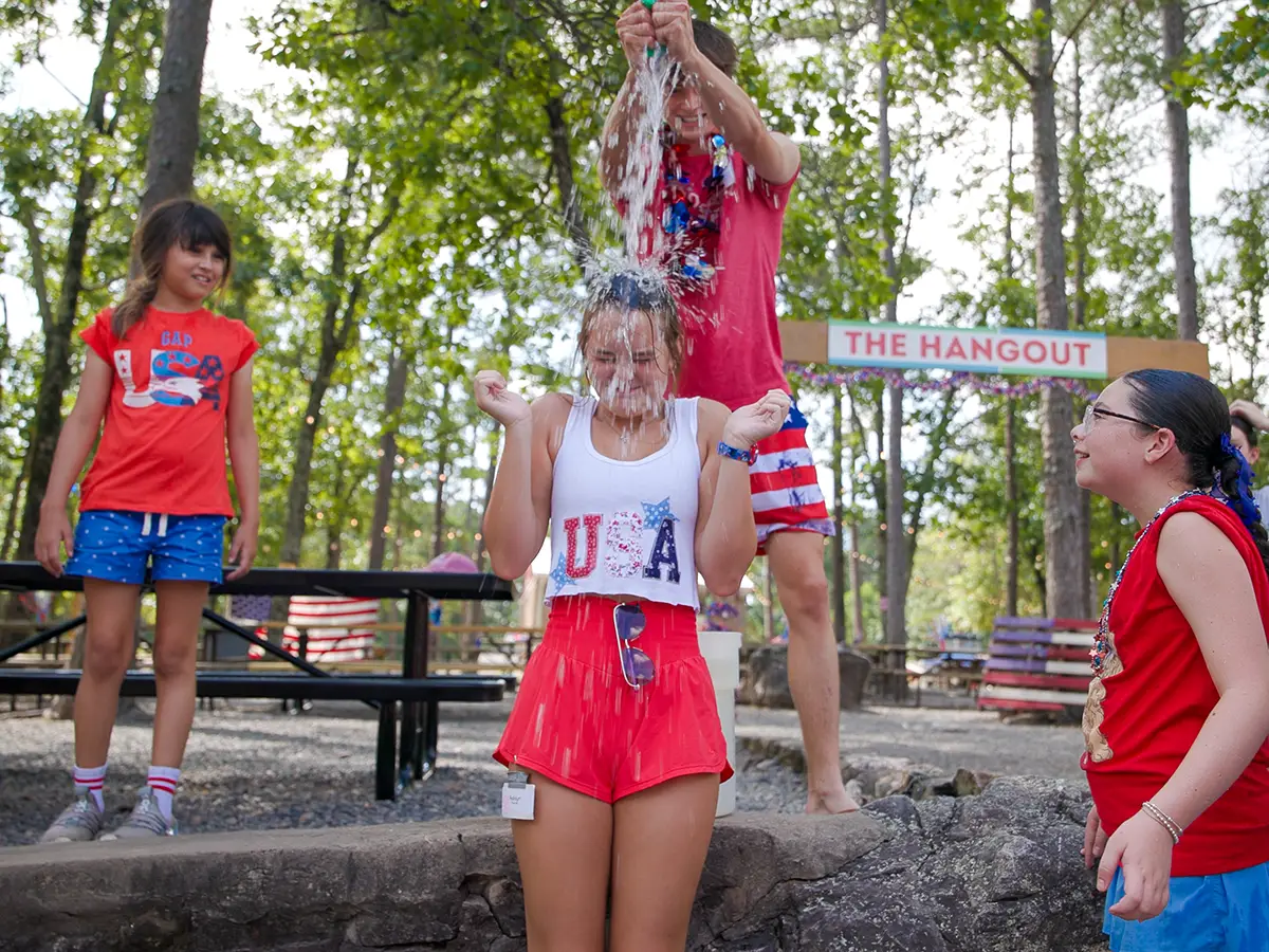 Campers dressed in red, white, and blue celebrating USA Day at Brookhill Ranch
